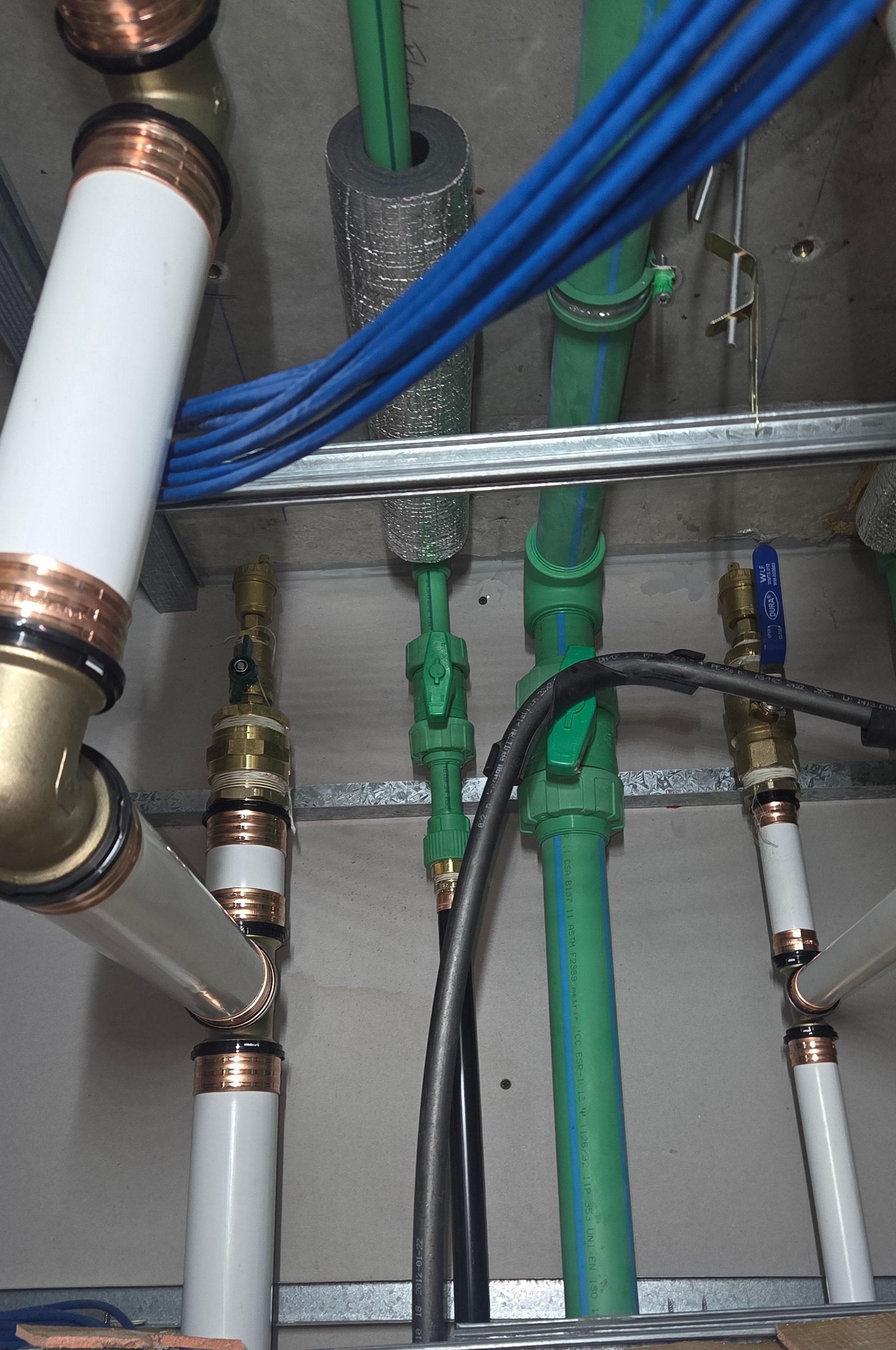 Hot-water pipework and isolation in the ceiling space at Adagio Apartments
